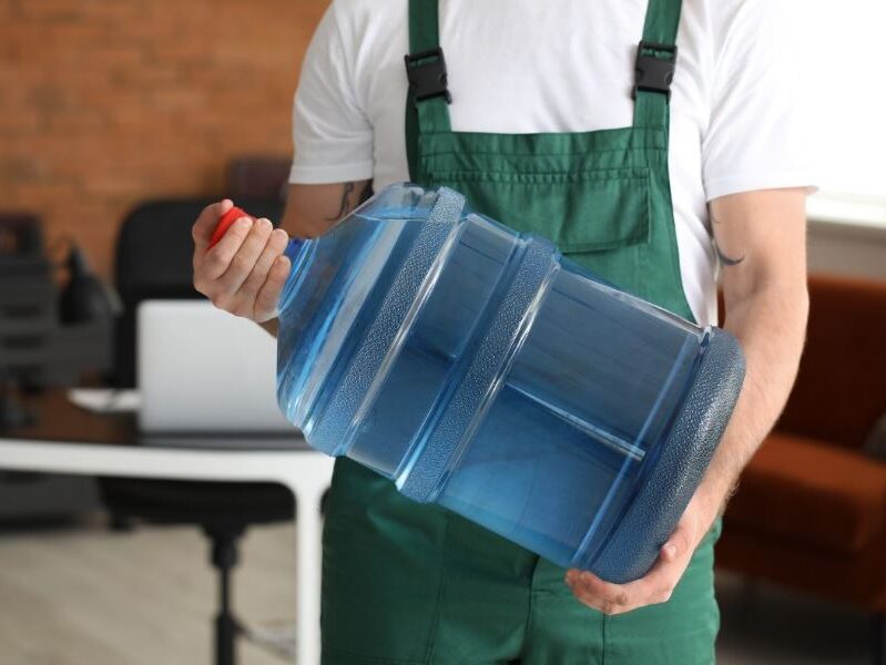 how to put a water bottle on a dispenser without spilling